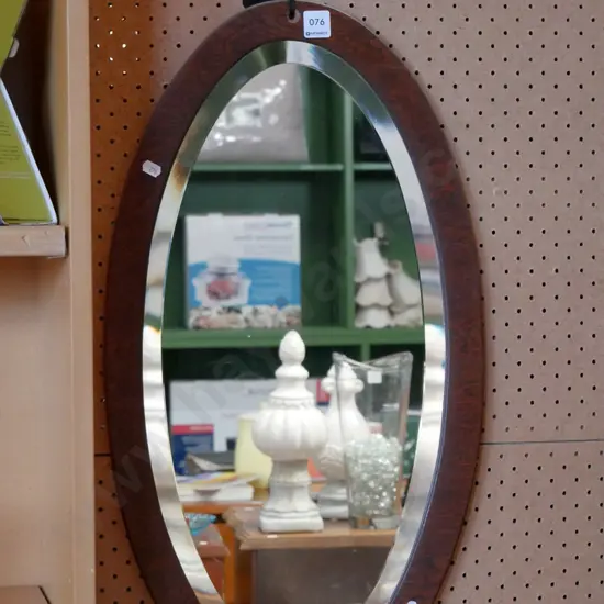 wood framed oval wall mirror