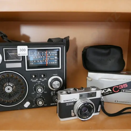 portable radio, 35mm film camera