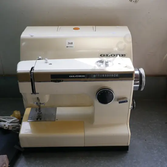 Globe sewing machine