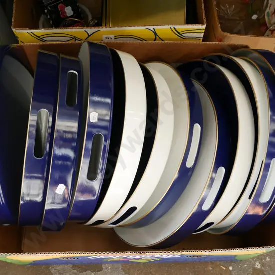 box of plastic circular trays