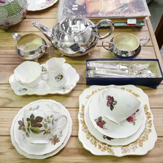 plated tea pot, creamer, sugar, cups, saucers, cased cutlery etc
