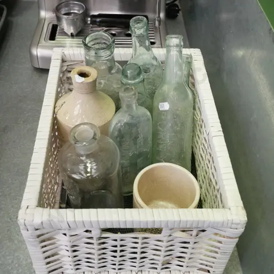 white cane basket, vintage bottles etc