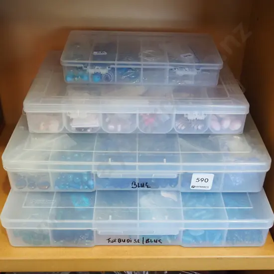 4x plastic containers of beads