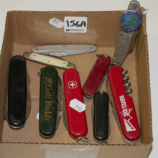 box of assorted pocket knives