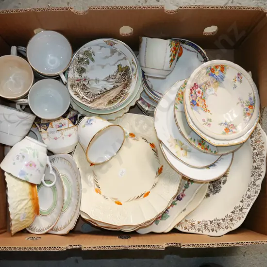 box of saucers, cups, plates