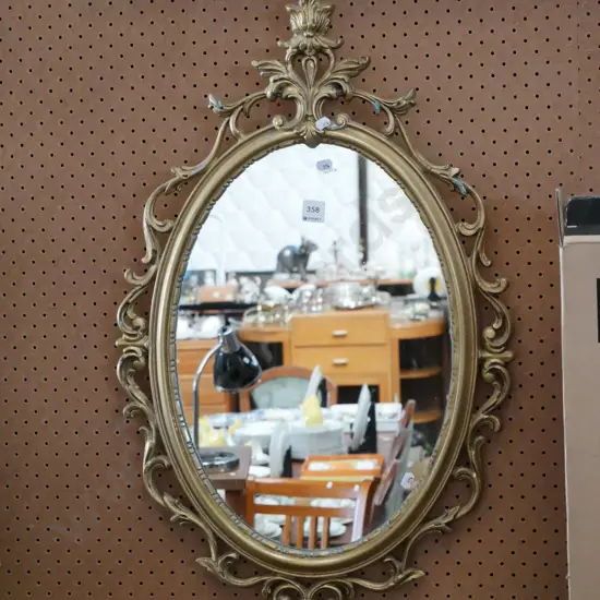 cast alloy gilt framed oval wall mirror