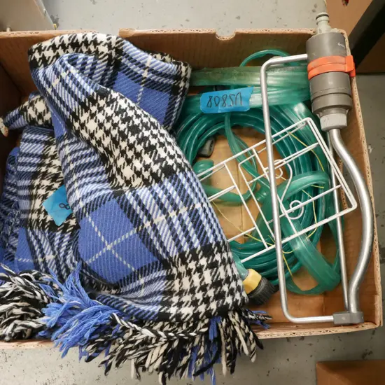 box; garden sprinkler, dripper hose, letter rack, travel rug