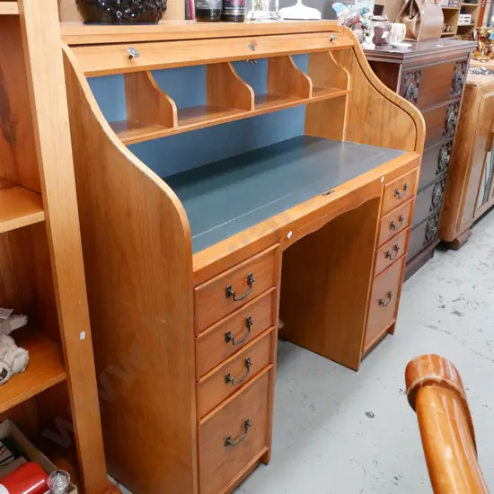pine 8 drawer roll top desk with fitted interior - key and lock in office