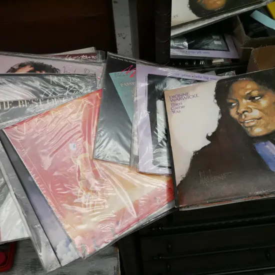 stack of LPs; Carly Simon etc