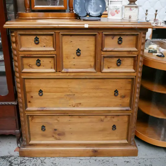 solid pine 7 drawer tall boy with cast metal drop handles H-1210 W-1100 D-500