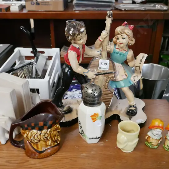 Italian boy and girl playing cello figurine, elephant bookends, small whisky jug etc