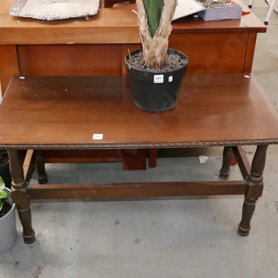 dark stained veneer turned leg coffee table