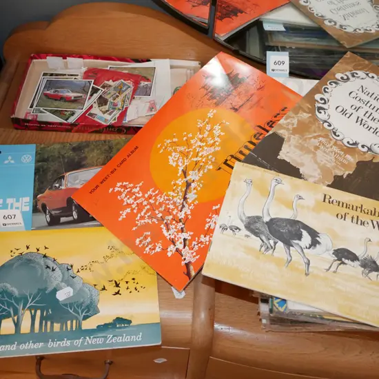 partly filled collector card albums and stamps