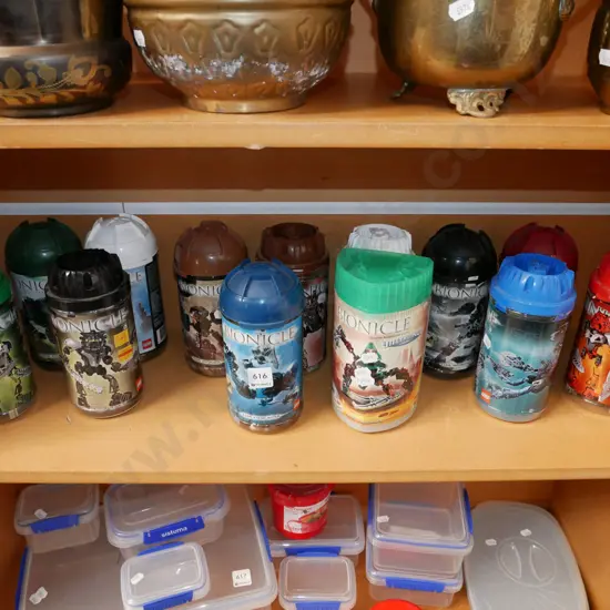 various containers of Lego bionicles