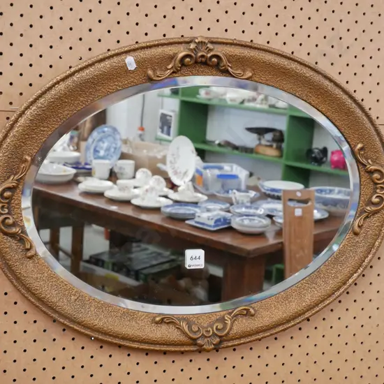 ornate bevelled edge oval wall mirror