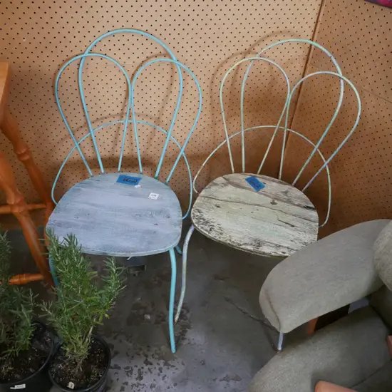 pair of wrought and wood outdoor chairs