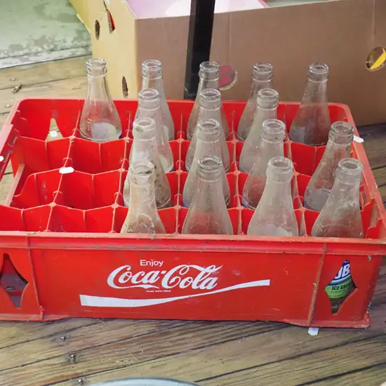 plastic Coca Cola tray and bottles