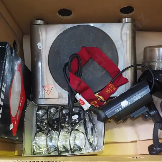 box; hot plate, reading glasses, scales, fake CCTV camera etc