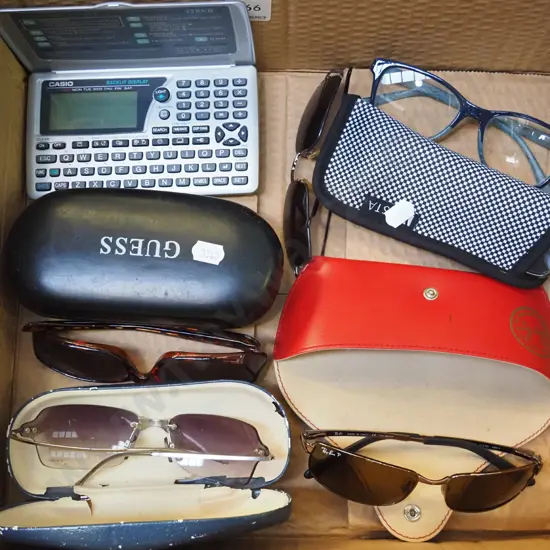 reading glasses, sunglasses, Casio digital diary