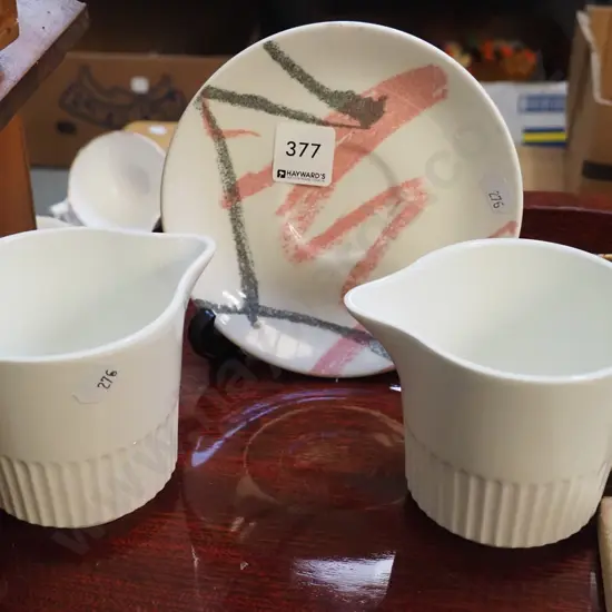 unusual graffiti Crown Lynn saucer, 2x Apollo milk jugs