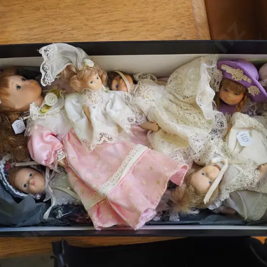 box of miniature dolls