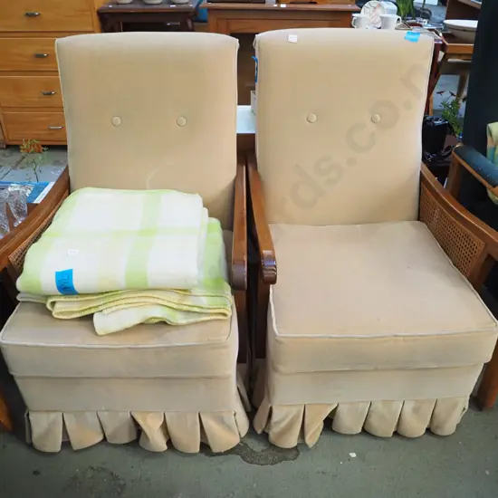 2x deep buttoned bergere armchairs - some fading to upholstery