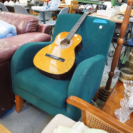 green upholstered armchair