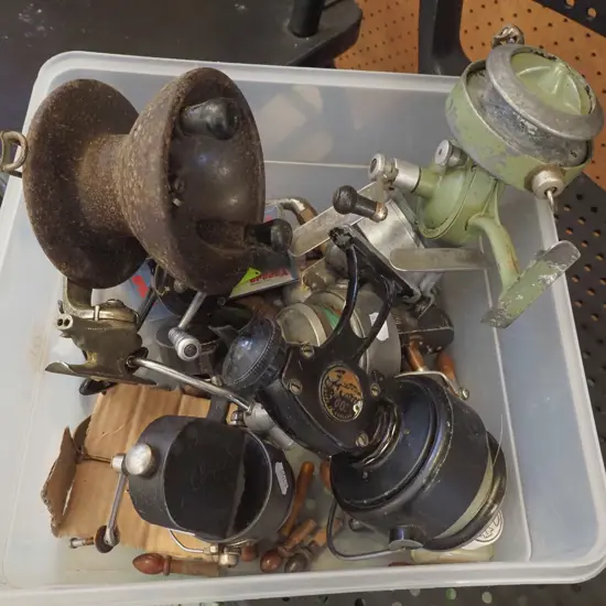 tub of fishing reels and lures