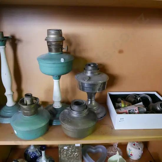 shelf of kerosene lantern parts