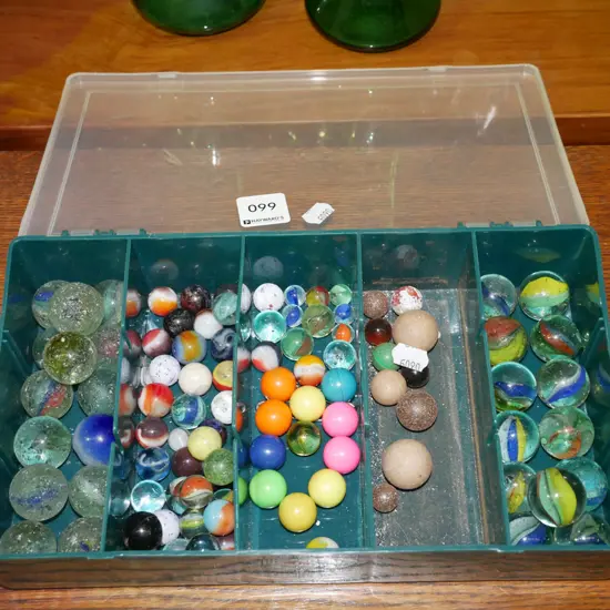 plastic organiser of various marbles