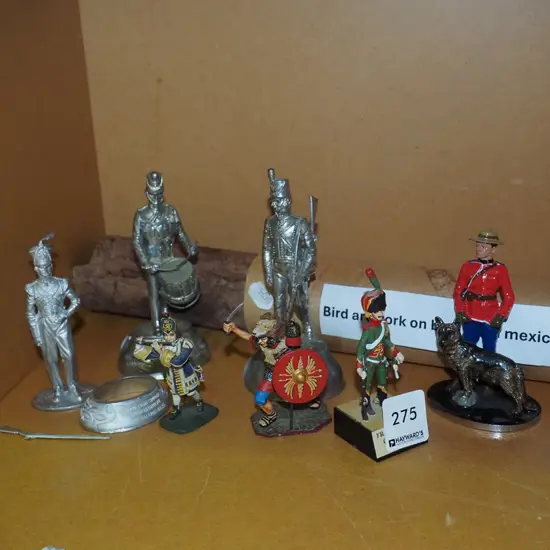 bird artwork on bark from Mexico, small military figurines