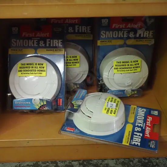 shelf of 5x smoke alarms