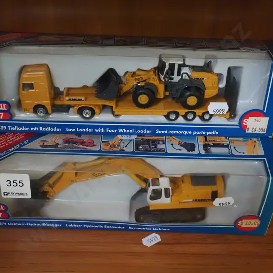 2x boxed scale models of low loader and 4 wheel loader, excavator
