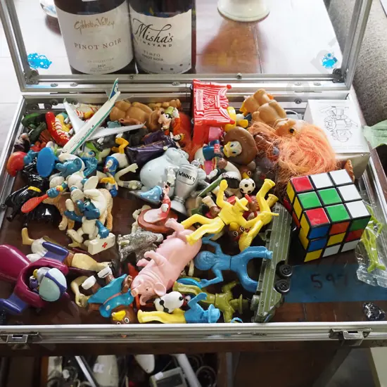 clear briefcase of various toys