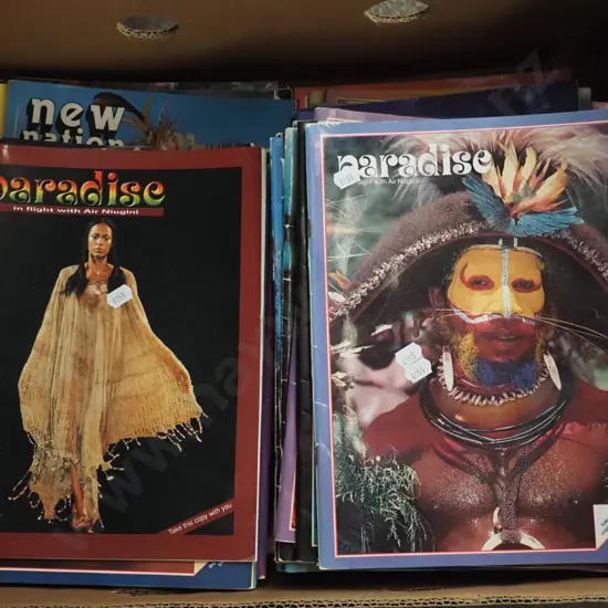 box; back issues of Paradise magazines