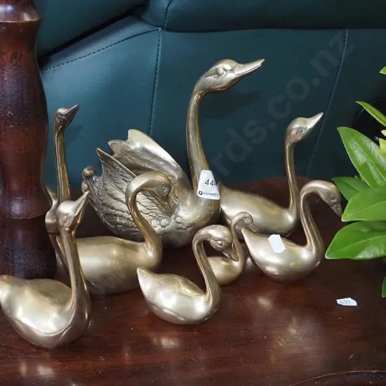 assorted brass ducks, brass swan vase