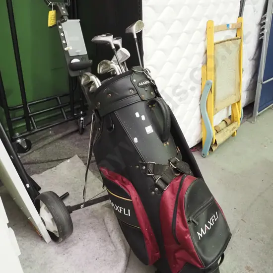 golf clubs and trundler