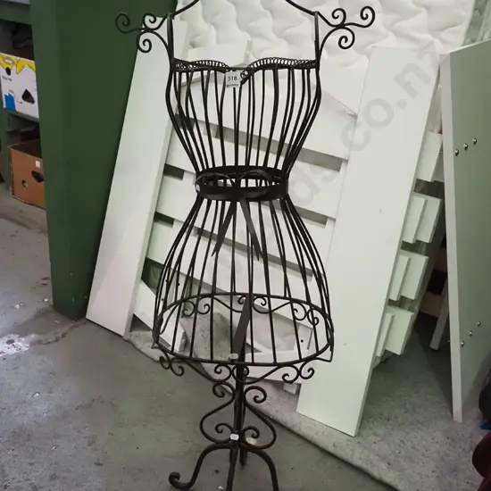 wrought metal mannequin on stand