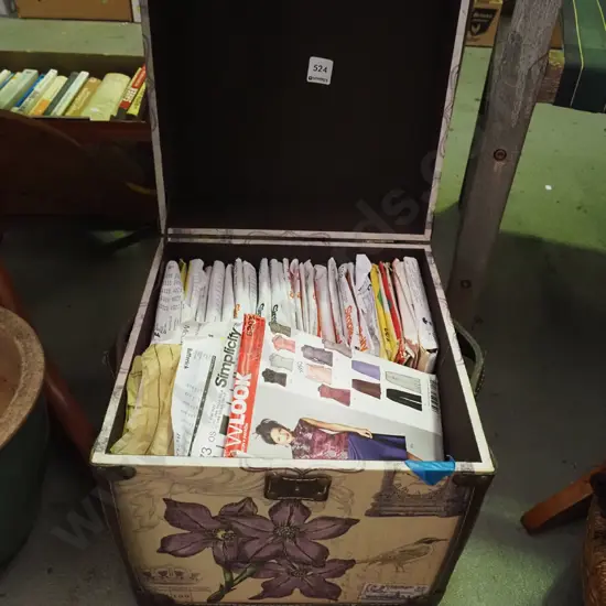 French themed lidded storage chest of sewing patterns