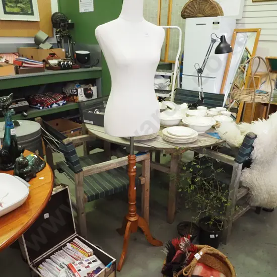 female mannequin on turned wooden stand