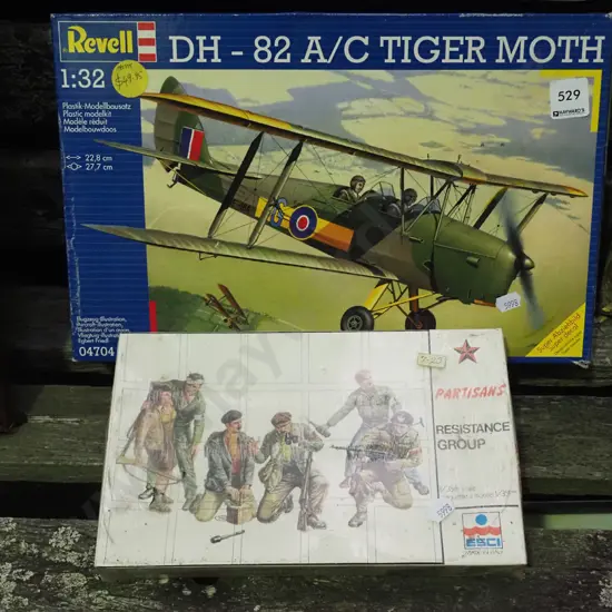 yet to assembled of a Tiger Mouth and model resistance group figurines
