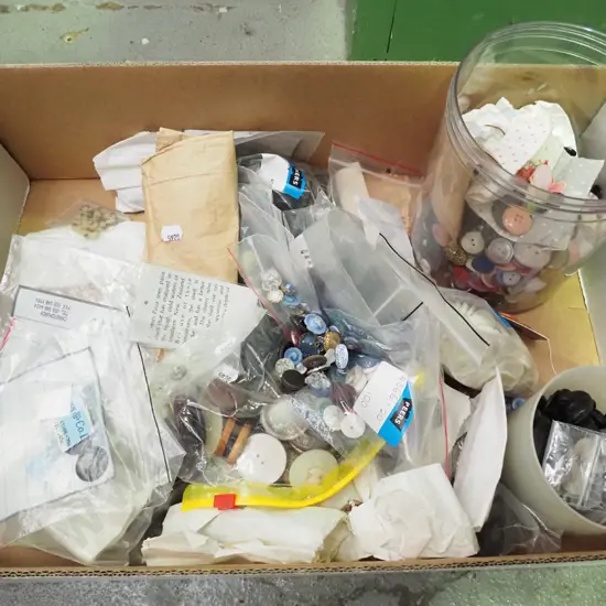 box of various buttons