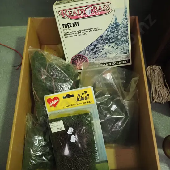 box of train layout trees and woodland scenes