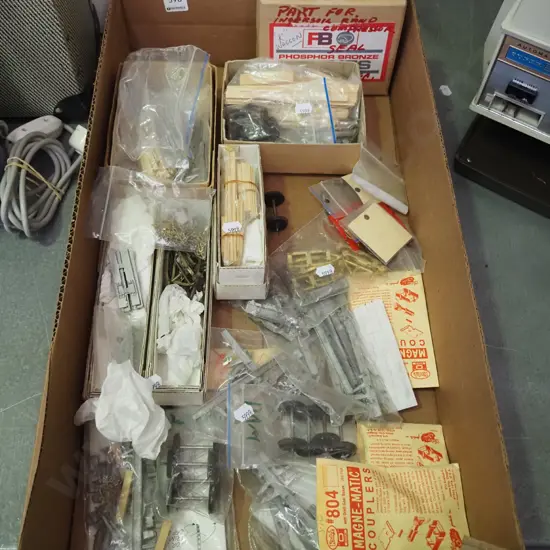 box; model train yet to be assembled carriages
