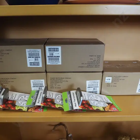 shelf of various meat thermometers