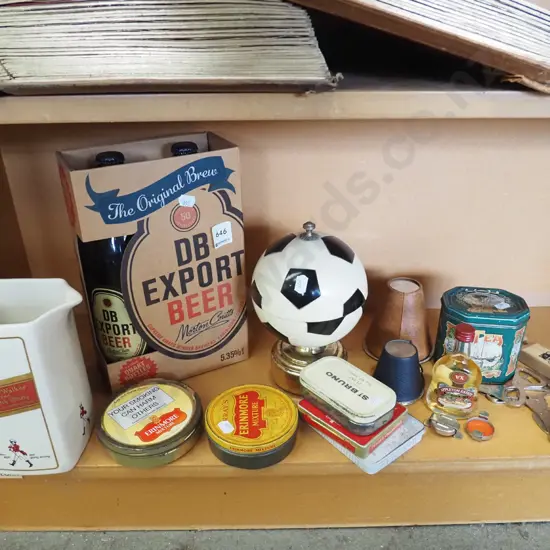shelf; tobacco tins, bottle openers, whisky jug etc
