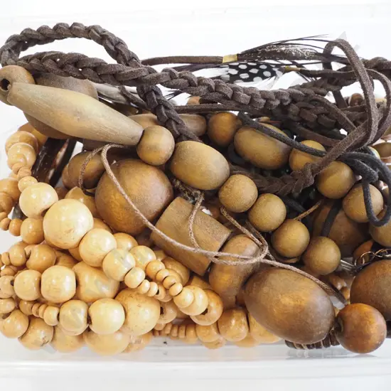 container of beaded necklaces etc