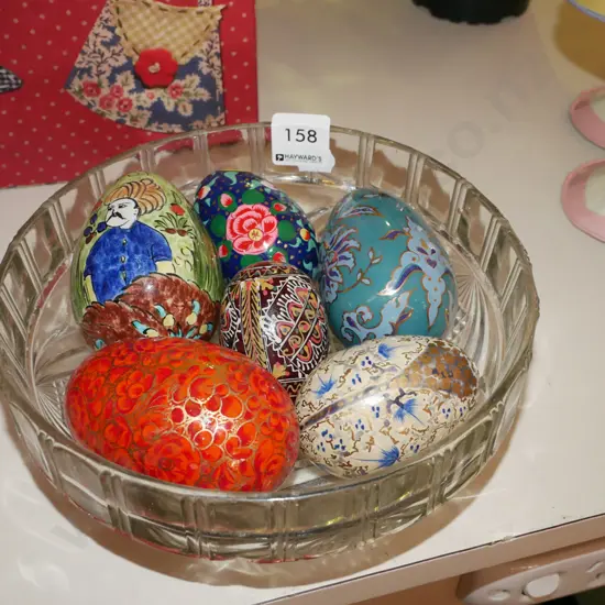 ornamental eggs in glass bowl