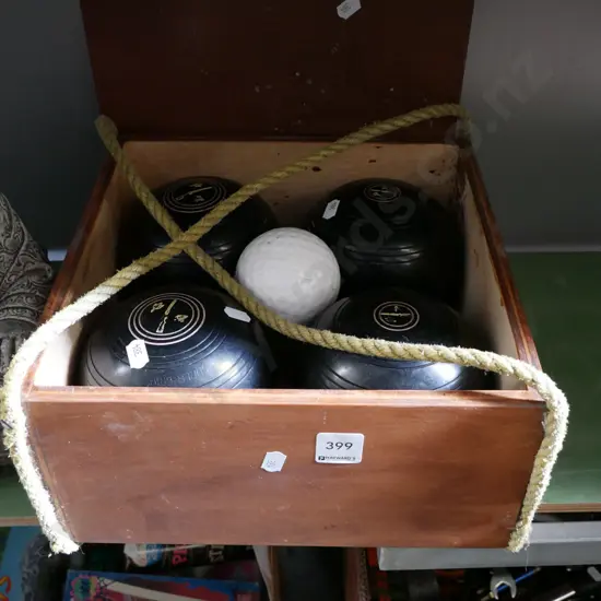 box; 4 lawn bowls, jack