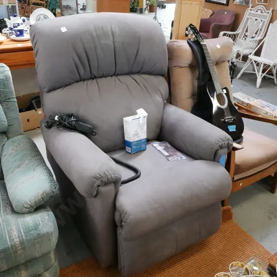 grey upholstered electric La Z Boy armchair - significant marking